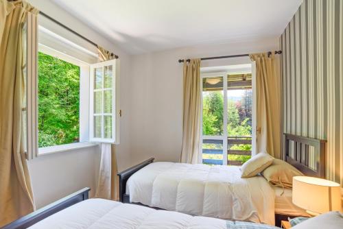 A bed or beds in a room at Lovely Villa with huge Garden surrounded by Nature