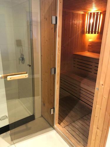 a shower with a glass door in a bathroom at Apartment Peninsula in Punta del Este
