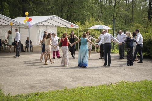 a group of people holding hands at a party at Hotel Chytrov in Volfířov