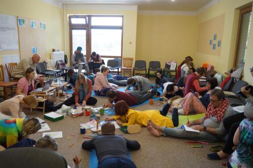 a group of people sitting on the floor in a room at Hotel Chytrov in Volfířov