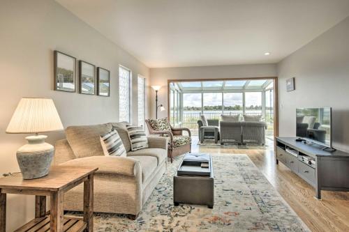 a living room with a couch and a table at Ideally Located San Francisco Bay Home with Sunroom! in Alameda