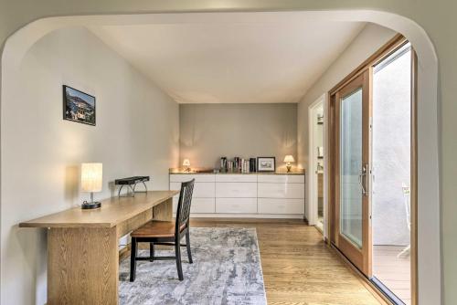 a dining room with a wooden table and chairs at Ideally Located San Francisco Bay Home with Sunroom! in Alameda