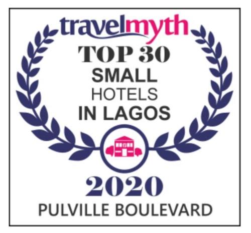 a logo for a hotel with a laurel wreath at Pulville Boulevard in Lagos