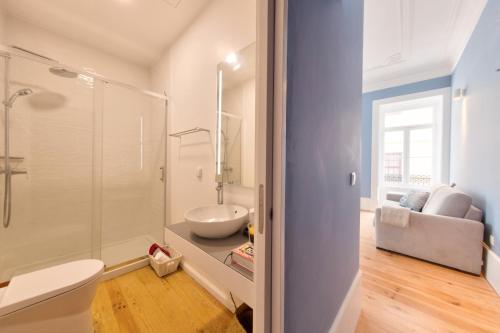 a bathroom with a shower and a sink and a toilet at Aveiro History Apartments in Aveiro