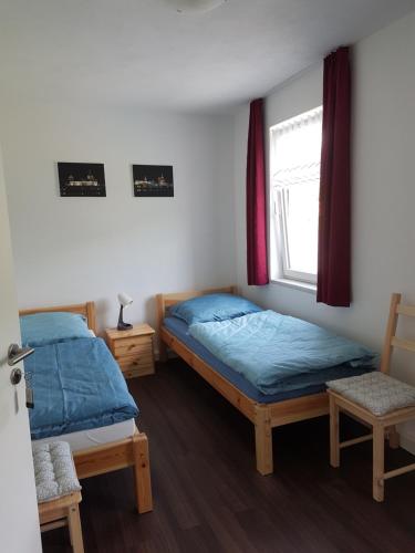 Ένα ή περισσότερα κρεβάτια σε δωμάτιο στο Haus Vogelgesang Pirna