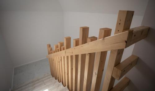 a wooden shelf on the side of a wall at Urban 7 Residence in Bucharest