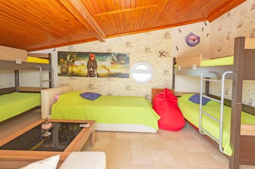 เตียงในห้องที่ Paradise Town Villa Camilla