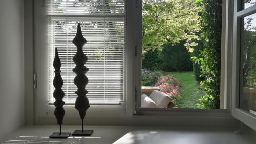 a window with a view of a living room at Casa Santo Stefano in Cernobbio