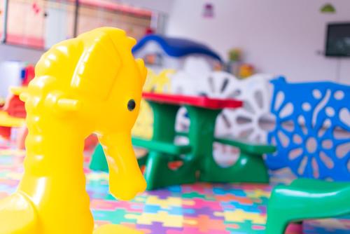 a plastic toy duck in front of a play set at Hotel Vilage Inn All Inclusive Poços de Caldas By Nacional Inn in Poços de Caldas