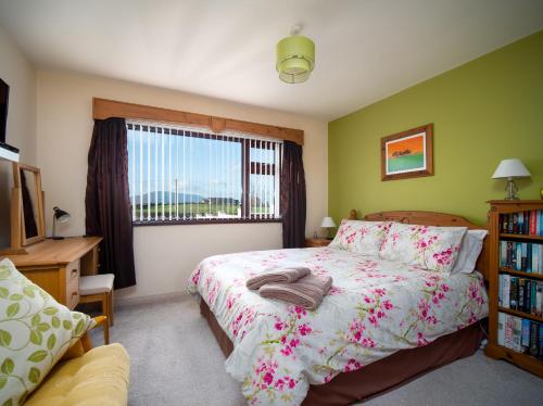 a bedroom with a bed and a window at A fourteen in Kilkeel