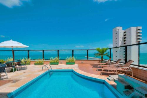 a swimming pool on the roof of a building at Maredomus Hotel in Fortaleza
