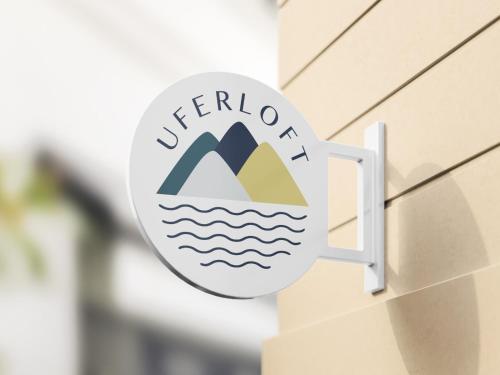 a sign on the side of a building at Uferloft in Immenstaad am Bodensee