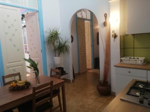 a kitchen with a table and a dining room at Apartamento Patricia in Hermigua