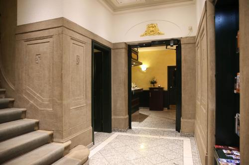 a hallway with stairs in a building at Parkhotel Plauen in Plauen