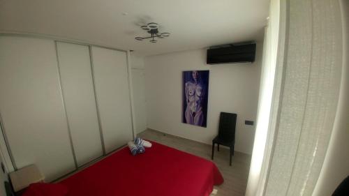 A bed or beds in a room at Aster Apartamento