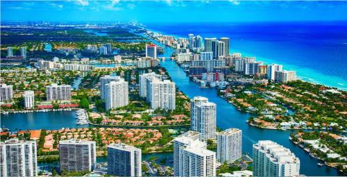 an aerial view of a city with a harbor at Bposhtels Hollywood Florida in Hollywood