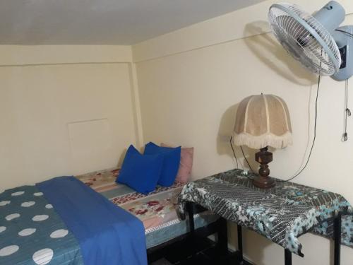 Un pat sau paturi într-o cameră la Vanny's Peaceful Guesthouse