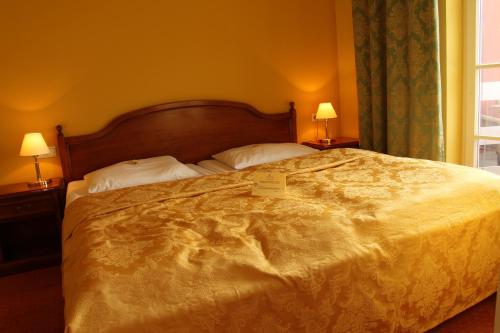 Postel nebo postele na pokoji v ubytování Strandhotel Deichgraf Graal-Müritz