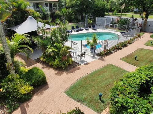 an aerial view of a swimming pool in a yard at Noosa River Retreat Holiday Apartments in Noosaville