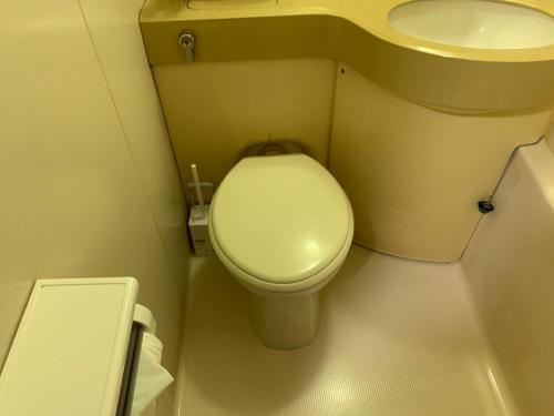 a small bathroom with a toilet and a sink at 交通アクセス便利! 9min from susukino station すすきの駅から歩いて9分 島屋ビル 505号室 in Sapporo