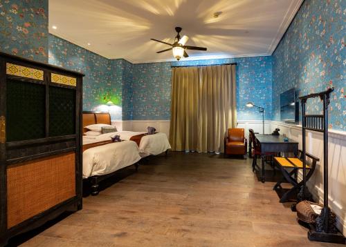 Postel nebo postele na pokoji v ubytování Guangzhou Nansha Stone Inn