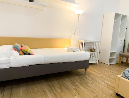 Postel nebo postele na pokoji v ubytování Butterfly Suite Rome