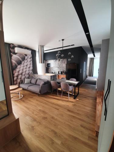 a living room with a couch and a table at Cotton House in Łódź