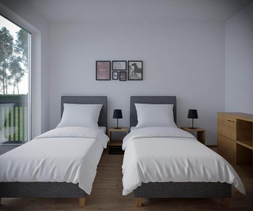 Кровать или кровати в номере ZatorHome apartamenty - blisko Energylandii