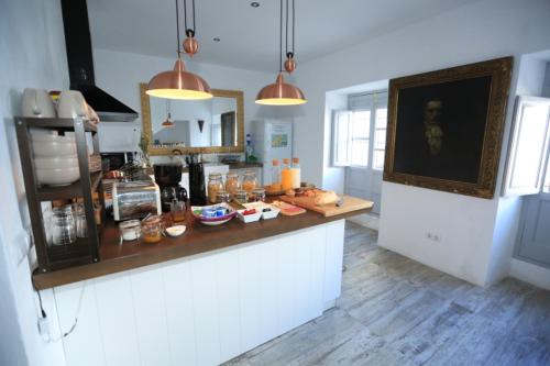 a kitchen with a counter with food on it at Casa Rural Miller's of Frigiliana in Frigiliana