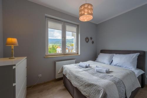 Postel nebo postele na pokoji v ubytování Apartament Zakątek Górski - 5D Apartamenty