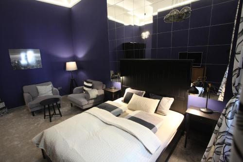 Posteľ alebo postele v izbe v ubytovaní Ambassador Apartment