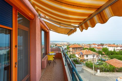 a balcony with a view of a city at Family Hotel Jemelly in Obzor