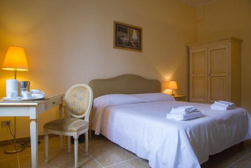 En eller flere senge i et værelse på Residence Ancona