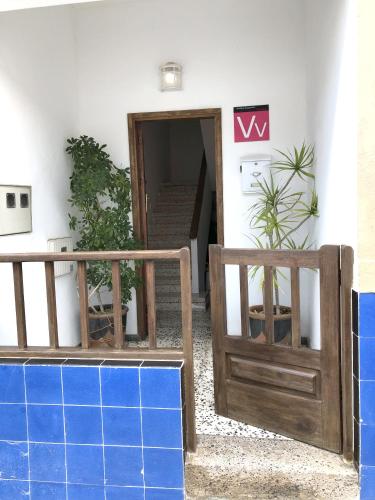 a door leading into a room with a staircase at La casa de la playa in Tarajalejo