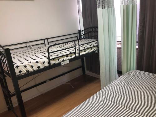 Ένα ή περισσότερα κρεβάτια σε δωμάτιο στο Yasuragi Nakasu