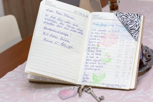 a notebook with handwriting on it sitting on a table at Nono Mario in Piran