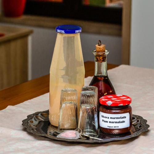 a tray with a bottle of sauce and other items on a table at Nono Mario in Piran
