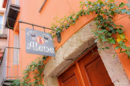 a sign for a restaurant on the side of a building at Sa Domo De Alene in Bosa