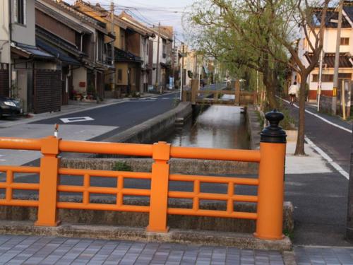 an orange fence on the side of a street at Super Hotel Izumo Ekimae in Izumo
