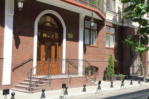 a brick building with a staircase and an entry way at Apartment in Center of Odessa in Odesa