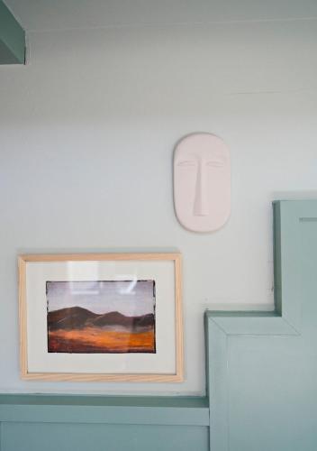 a picture frame on a wall with a painting at The Times Hotel in Amsterdam