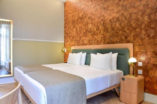 Postel nebo postele na pokoji v ubytování My Story Hotel Tejo