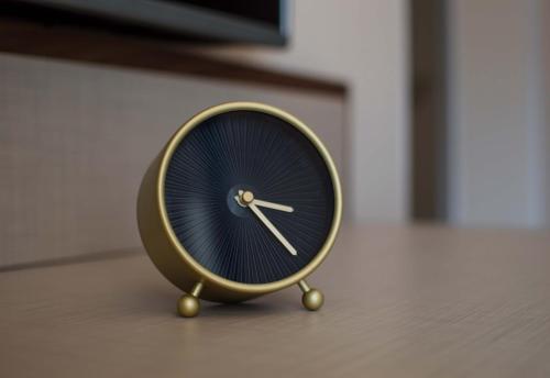 a small blue and gold clock sitting on the floor at Ana's Place in Kotor