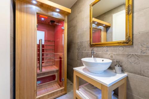 a bathroom with a sink and a mirror at Lucy in Omiš