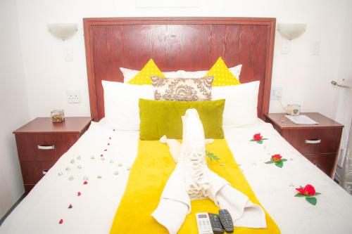 Sinesan Guesthouseにあるベッド