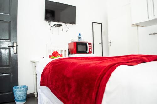 Sinesan Guesthouseにあるベッド