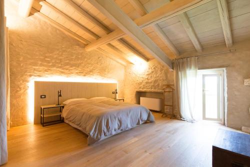 Postel nebo postele na pokoji v ubytování VILLA SACCOMANI