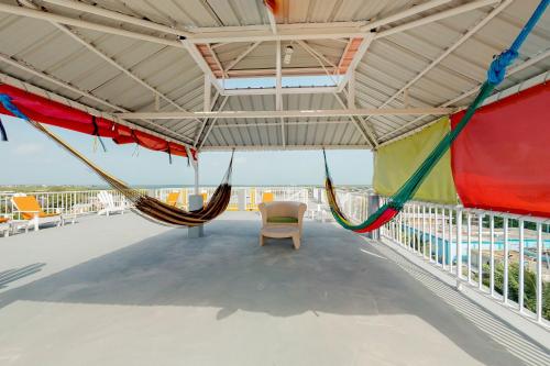 a hammock on the roof of a building at Laguna Suites in San Pedro