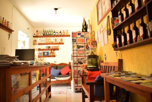 a room filled with lots of bottles of wine at Pousada Colonetti in Lindóia