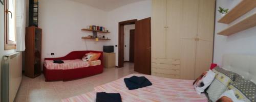 a bedroom with a bed and a room with at Appartamento Alla Corte in Venice